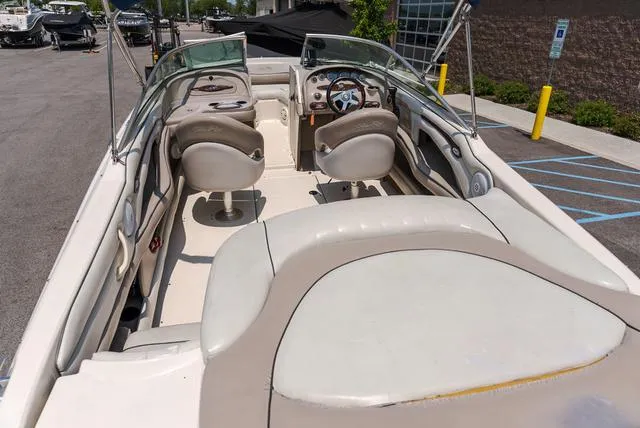 Slide: The Image of 2003 Sea Ray 240 SIGNATURE boat interior with dual seats and steering wheel. - 5