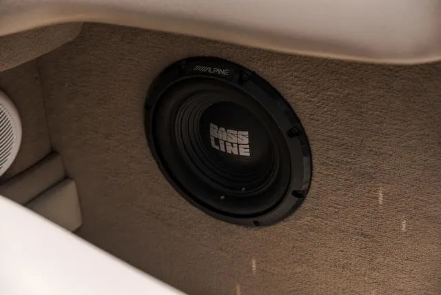 Slide: The Image of Alpine Bass Line speaker in 2003 Sea Ray 240 Signature boat interior. - 8