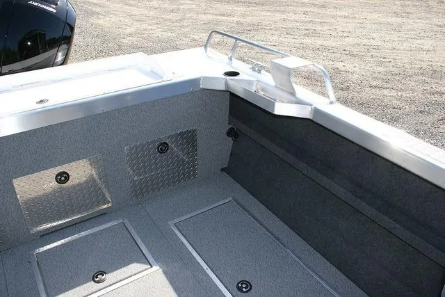 Slide: The Image of 2025 Thunder Jet 200 Luxor boat interior with storage compartments and diamond plate accents. - 11