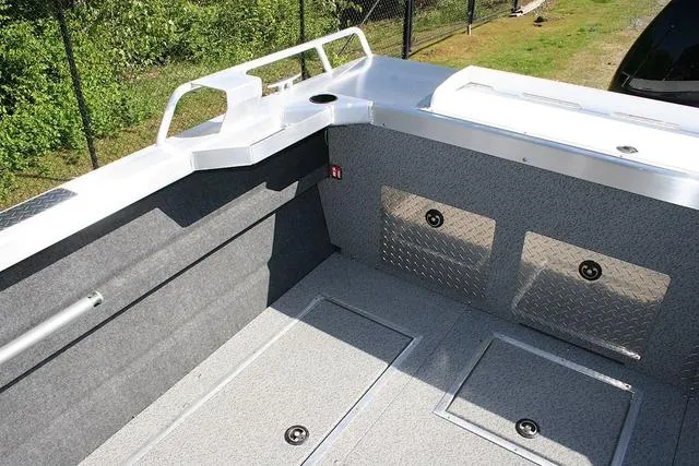 Slide: The Image of 2025 Thunder Jet 200 Luxor boat interior with storage compartments and sleek design. - 12