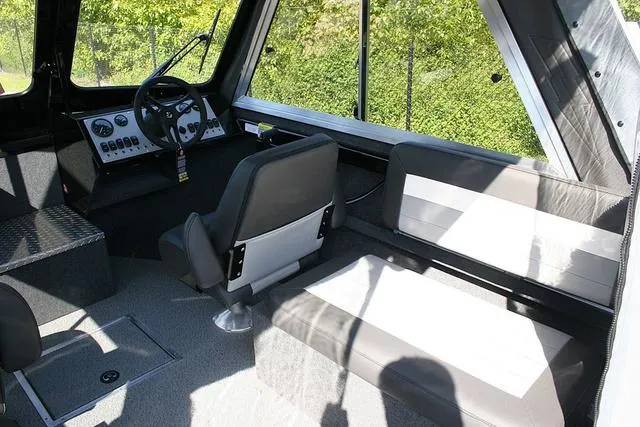 Slide: The Image of Interior of 2025 Thunder Jet 200 Luxor boat with seating and control panel. - 6