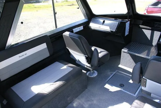 Slide: The Image of Interior of 2025 Thunder Jet 200 Luxor boat with seating and storage compartments. - 7