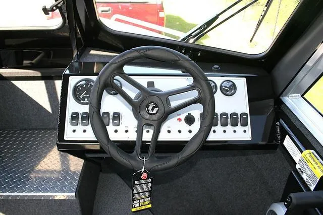 Slide: The Image of 2025 Thunder Jet 200 Luxor boat dashboard with steering wheel and control panel. - 8