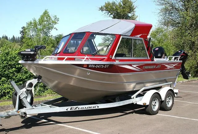 Slide: The Image of 2021 Thunder Jet 185 Luxor boat on trailer in a parking lot. - 1