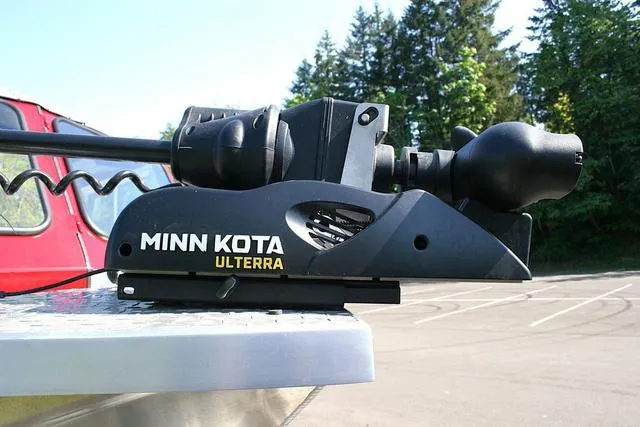 Slide: The Image of Minn Kota Ulterra motor on 2021 Thunder Jet 185 Luxor boat, parked outdoors. - 13
