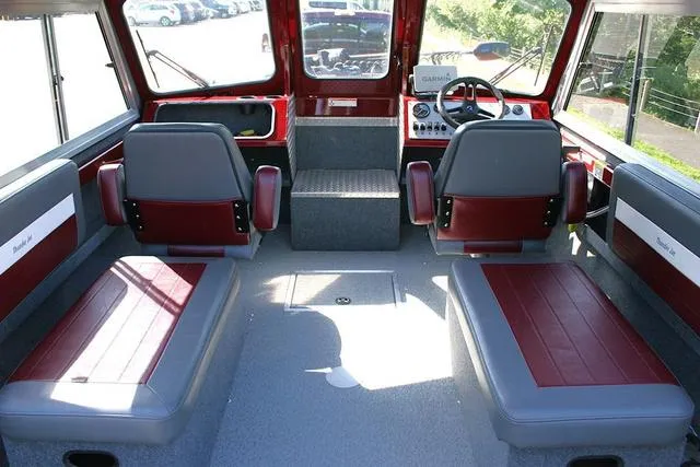 Slide: The Image of 2021 Thunder Jet 185 Luxor boat interior with red and gray seating and steering console. - 5