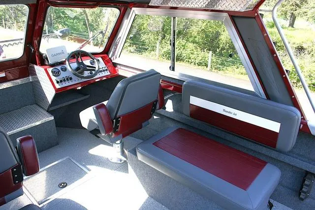 Slide: The Image of 2021 Thunder Jet 185 Luxor boat interior with steering console and seating. - 6