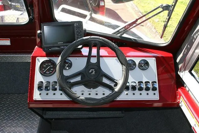 Slide: The Image of Dashboard of 2021 Thunder Jet 185 Luxor boat with steering wheel and control panel. - 8