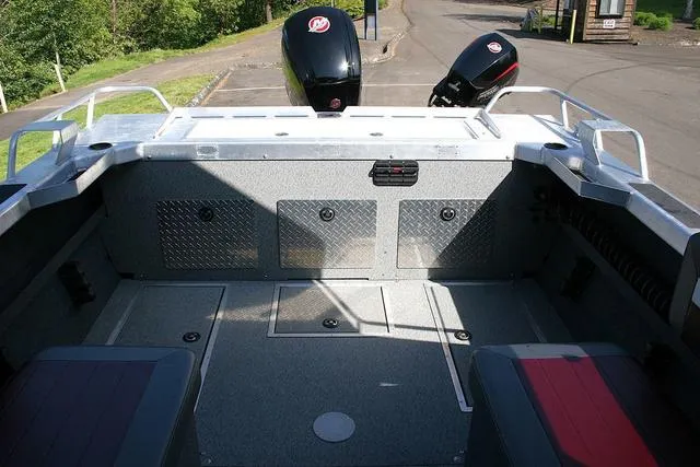 Slide: The Image of 2021 Thunder Jet 185 Luxor boat interior with dual outboard motors, spacious seating, and storage compartments. - 9