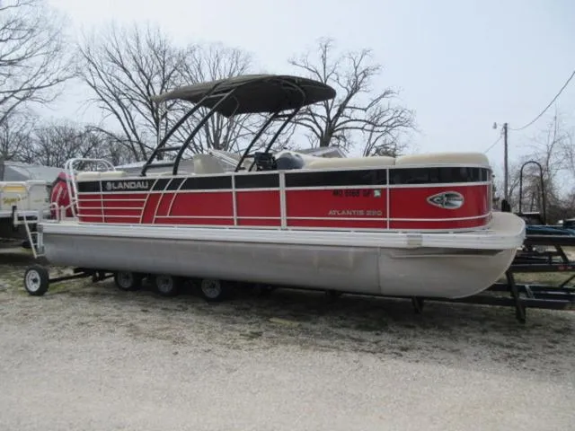 Slide: The Image of 2017 Landau 230C Atlantis Cruise Tritoon with 200 Evinrude G2 Ete, red and white design. - 1