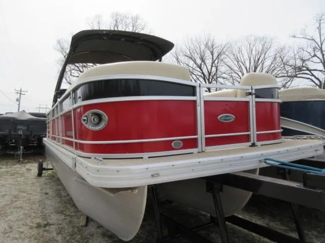 Slide: The Image of 2017 Landau 230C Atlantis Cruise Tritoon with red and black exterior on display. - 10