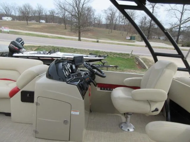 Slide: The Image of 2017 Landau 230C Atlantis Cruise Tritoon interior with helm and seating. - 19