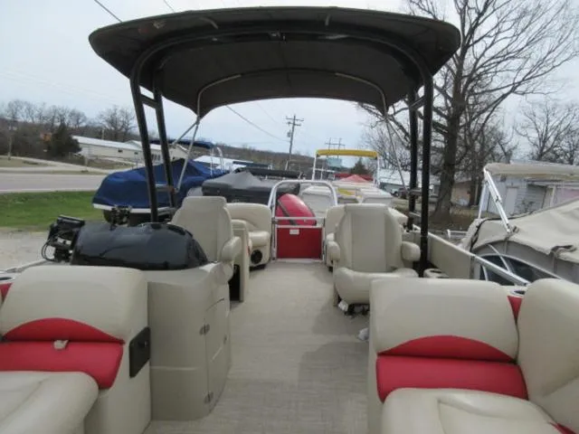 Slide: The Image of 2017 Landau 230C Atlantis Cruise Tritoon with 200 Evinrude G2 Ete, featuring spacious seating. - 2