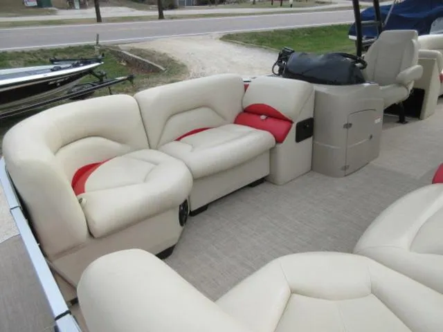 Slide: The Image of Luxurious seating on 2017 Landau 230C Atlantis Cruise Tritoon boat, featuring beige and red upholstery. - 21