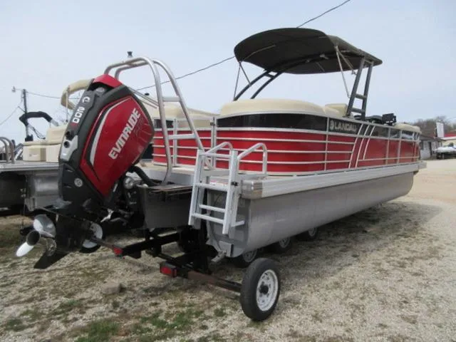 Slide: The Image of 2017 Landau 230C Atlantis Cruise Tritoon with 200 Evinrude G2 engine on trailer. - 4
