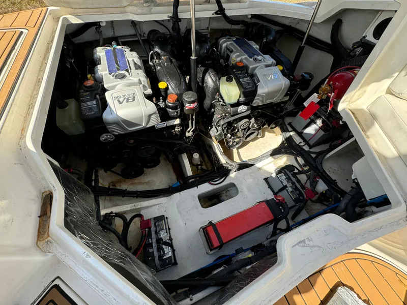 Slide: The Image of Engine compartment of a 2015 Sea Ray 350 SLX boat, showcasing dual engines and components. - 26