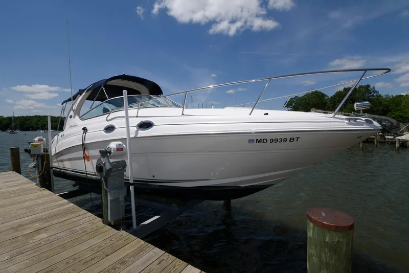 Slide: The Image of 2005 Sea Ray 280 Sundancer docked on a sunny day with clear skies. - 1