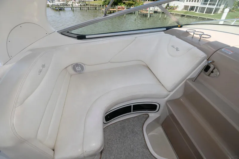 Slide: The Image of 2005 Sea Ray 280 Sundancer interior seating with waterfront view. - 6