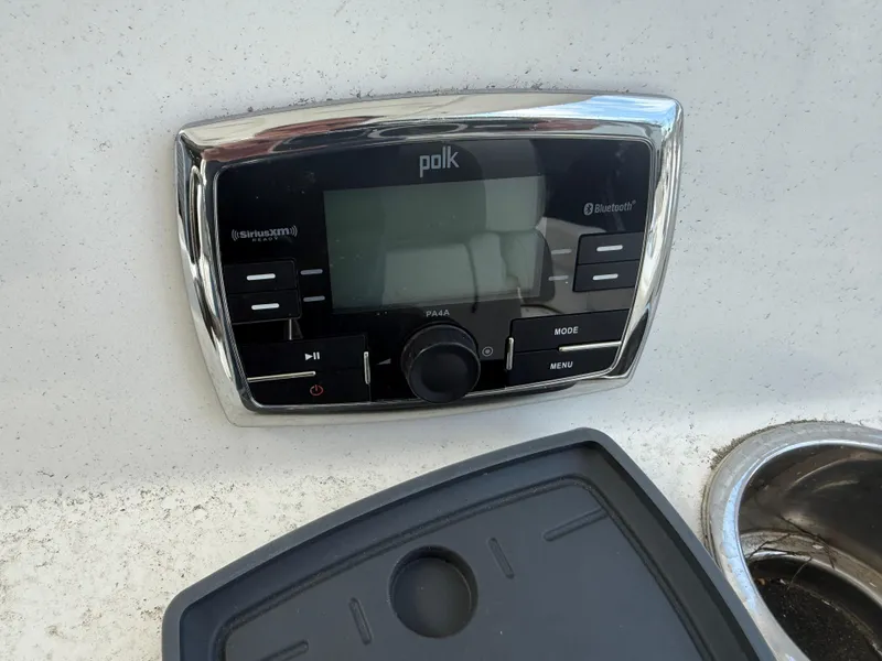 Slide: The Image of Polk audio system on 2015 Tidewater 230 LXF boat dashboard. - 7