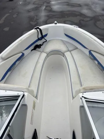 Slide: The Image of 2006 Bayliner 205 MX boat interior with white and blue seating. - 15