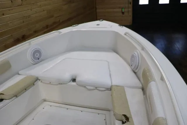 Slide: The Image of 2007 Everglades 223CC boat interior with white seating and speakers. - 17
