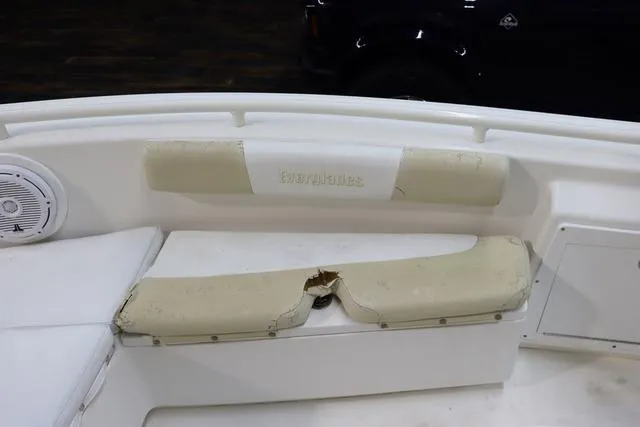 Slide: The Image of 2007 Everglades 223CC boat interior with damaged seating and speaker. - 19