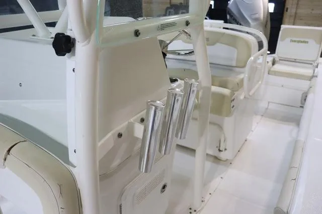 Slide: The Image of 2007 Everglades 223CC boat interior with rod holders and seating. - 22
