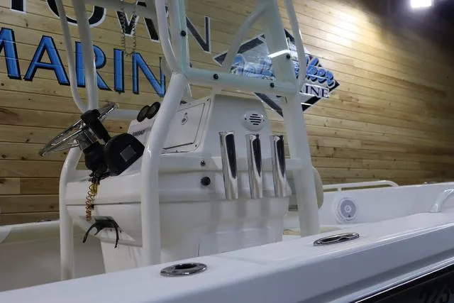 Slide: The Image of 2007 Everglades 223CC boat interior with steering console and rod holders. - 28