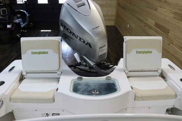 Slide: The Image of 2007 Everglades 223CC boat with Honda outboard motor and seating. - 7