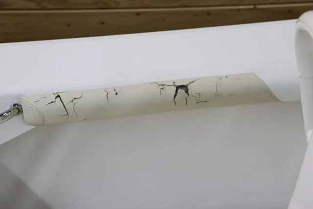 Slide: The Image of Cracked handle on 2007 Everglades 223CC boat, showing wear and tear. - 9