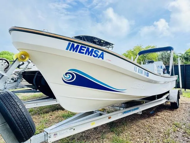 Slide: The Image of 2017 Panga 25 boat on trailer, featuring IMEMSA branding and blue wave design. - 1