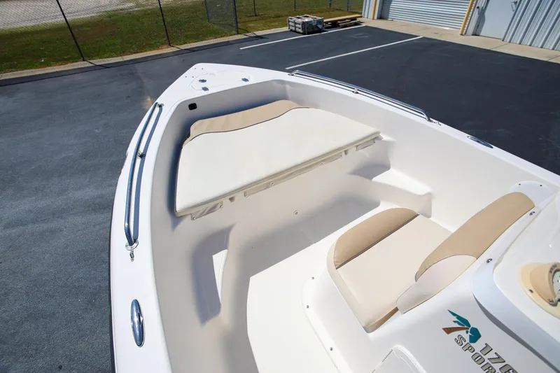 Slide: The Image of 2016 Key West 176 Center Console boat interior with cushioned seating and storage. - 13