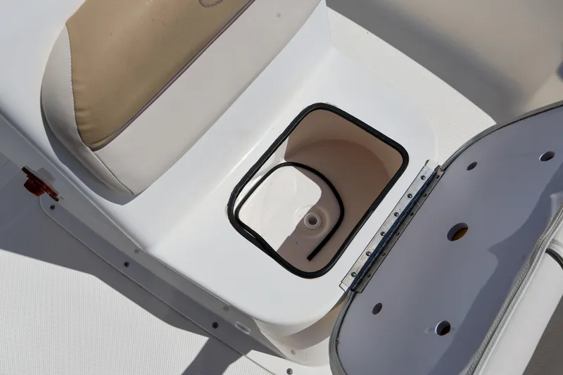 Slide: The Image of Open storage compartment on 2016 Key West 176 Center Console boat. - 16
