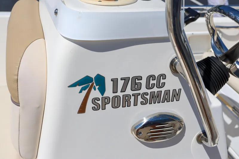 Slide: The Image of 2016 Key West 176 Center Console boat dashboard with logo and steering wheel. - 19
