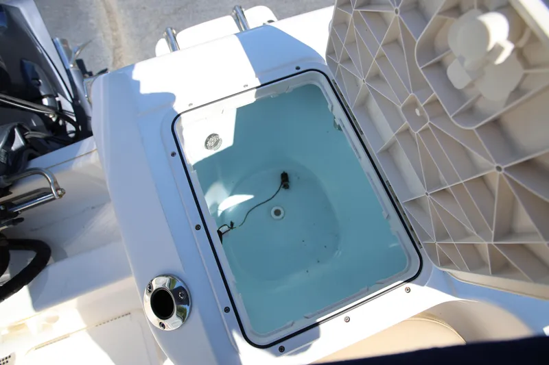 Slide: The Image of Open storage compartment on a 2016 Key West 176 Center Console boat. - 20