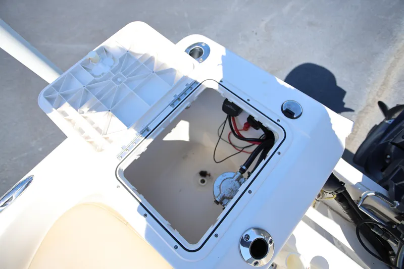 Slide: The Image of Open storage compartment on a 2016 Key West 176 Center Console boat. - 21