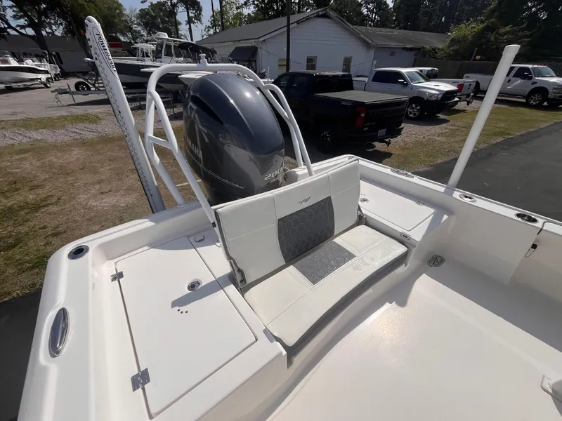 Slide: The Image of 2020 Tidewater 2210 Carolina Bay boat with Yamaha outboard engine, featuring a spacious seating area. - 6