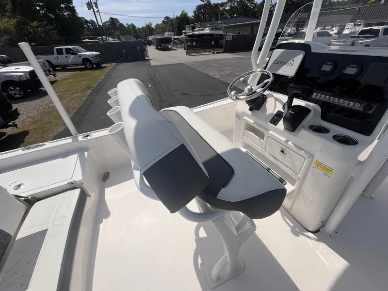 Slide: The Image of 2020 Tidewater 2210 Carolina Bay boat interior with helm and seating area. - 7