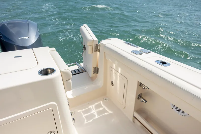 Slide: The Image of 2015 Grady-White Freedom 375 boat deck with open transom door, ocean view. - 16