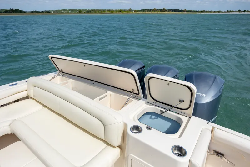 Slide: The Image of 2015 Grady-White Freedom 375 boat with open storage, twin engines, and ocean view. - 17