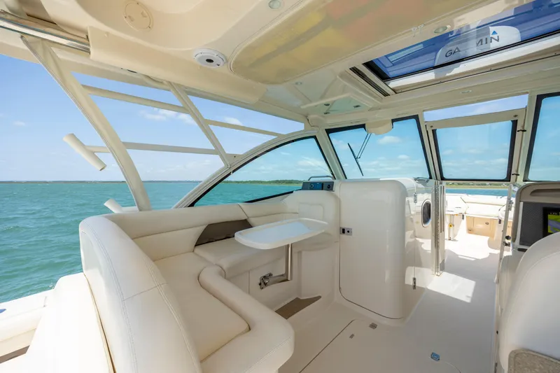 Slide: The Image of 2015 Grady-White Freedom 375 boat interior with seating and ocean view. - 24