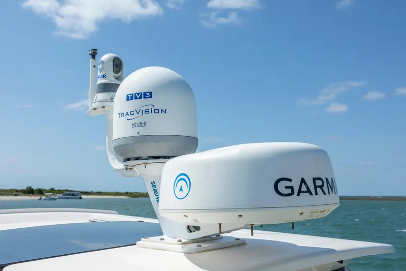 Slide: The Image of Grady-White Freedom 375 (2015) with Garmin and TracVision equipment on a sunny day. - 28