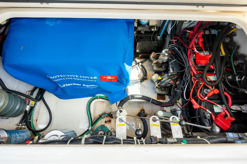 Slide: The Image of Engine compartment of 2015 Grady-White Freedom 375 with protective cover and wiring. - 30