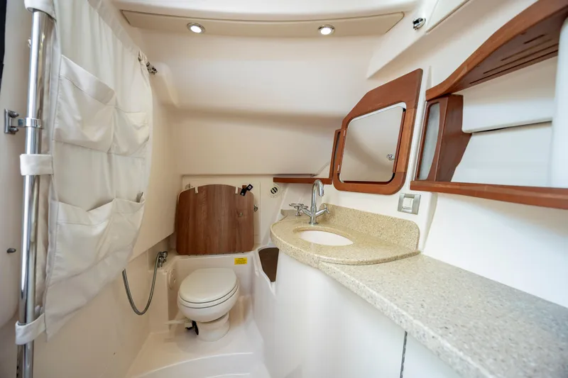Slide: The Image of 2015 Grady-White Freedom 375 boat bathroom with sink, toilet, and storage. - 37