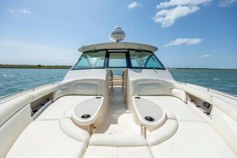 Slide: The Image of 2015 Grady-White Freedom 375 boat with spacious seating on open water. - 9