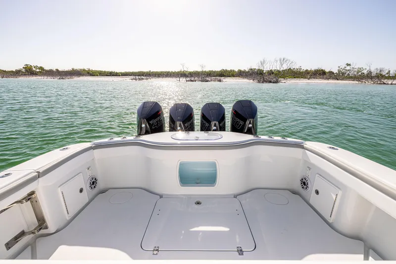 Slide: The Image of 2023 Yellowfin 39 Offshore boat with four engines on calm water. - 15