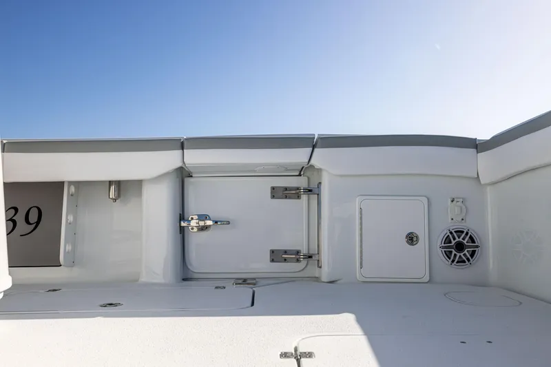 Slide: The Image of 2023 Yellowfin 39 Offshore boat interior with storage compartments and speaker. - 16