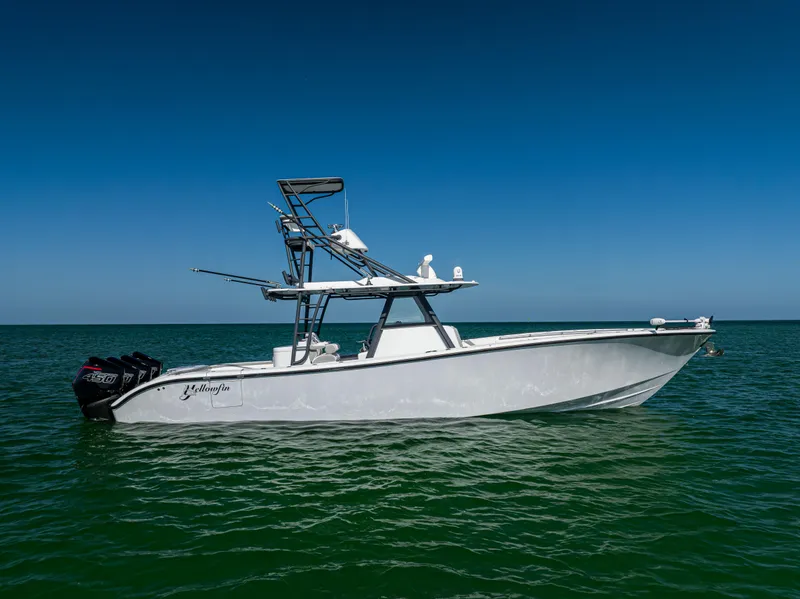 Slide: The Image of 2023 Yellowfin 39 Offshore boat on calm sea under clear blue sky. - 2
