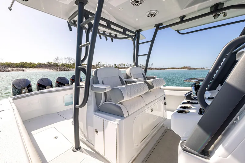 Slide: The Image of 2023 Yellowfin 39 Offshore boat interior with seating and ocean view. - 22