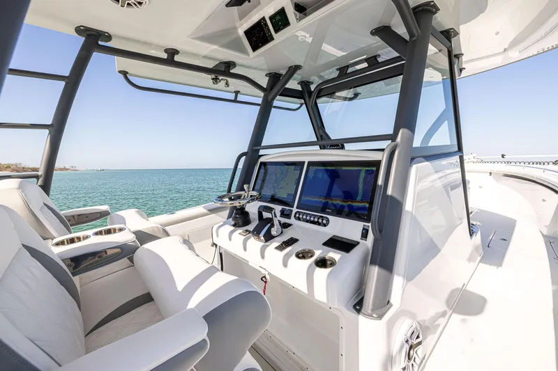 Slide: The Image of 2023 Yellowfin 39 Offshore boat cockpit with advanced navigation systems and luxurious seating. - 24